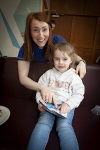 Julie White, SWEET Project Manager, Old Library Trust having a look at the new App with three years old Mia Doolin on Friday.